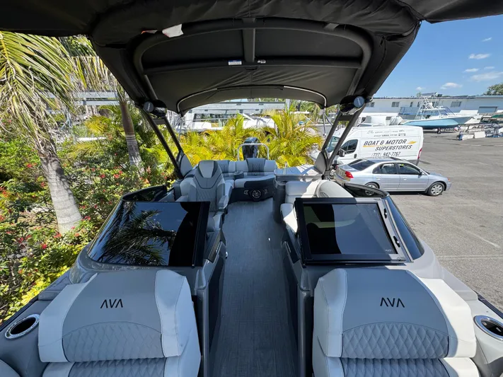  Yacht Photos Pics Luxurious 2025 Avalon Excalibur 27' boat interior with plush seating and modern design.