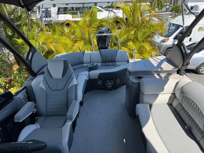  Yacht Photos Pics Luxurious 2025 Avalon Excalibur 27' pontoon boat interior with plush seating and modern design.