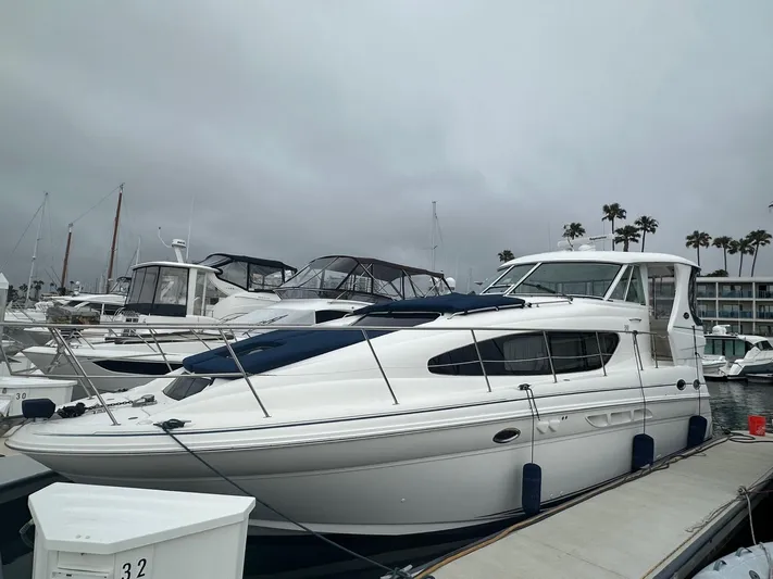 Ballerina Yacht Photos Pics 2004 Sea Ray 390 Motor Yacht docked at marina under cloudy skies.