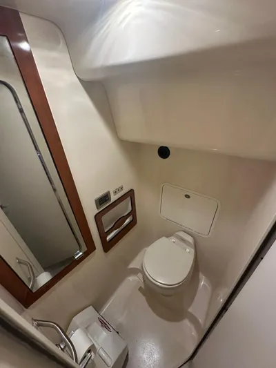 Ballerina Yacht Photos Pics 2004 Sea Ray 390 Motor Yacht bathroom with toilet, mirror, and storage.