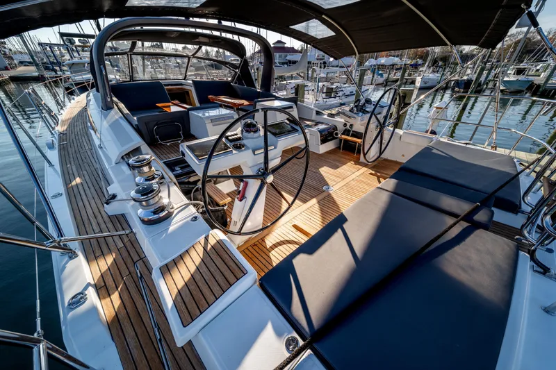 Serenity Yacht Photos Pics Luxurious 2016 Jeanneau 64 yacht cockpit with teak decking and dual steering wheels.