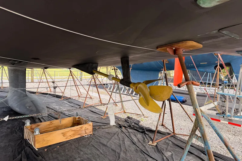 Serenity Yacht Photos Pics Underwater view of 2016 Jeanneau 64 sailboat's propeller and keel in dry dock.