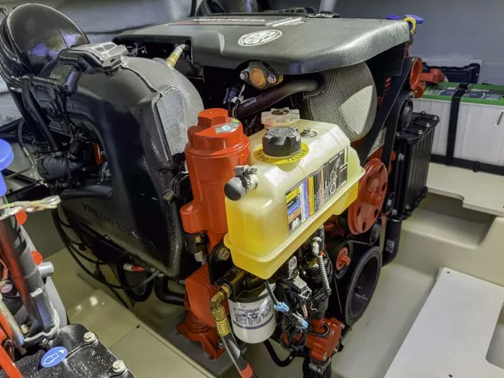 Get Back Yacht Photos Pics Engine compartment of 2022 Chris-Craft Launch 31 GT boat, showcasing detailed mechanical components.