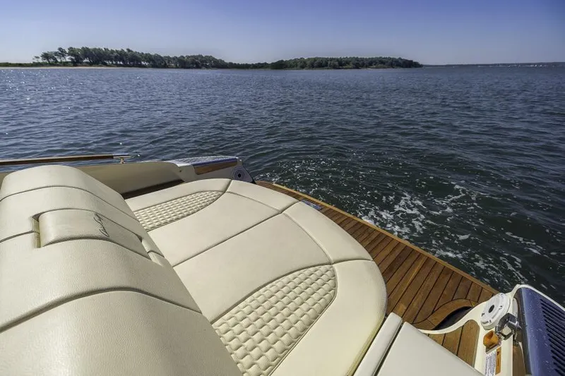 Get Back Yacht Photos Pics 2022 Chris-Craft Launch 31 GT boat with luxurious seating on a serene lake.