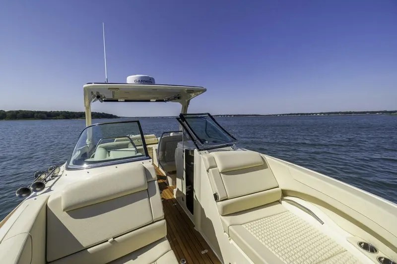 Get Back Yacht Photos Pics 2022 Chris-Craft Launch 31 GT boat on calm water, featuring luxurious seating and open deck.