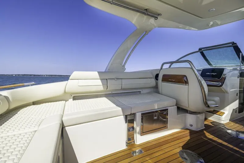 Get Back Yacht Photos Pics Luxurious interior of 2022 Chris-Craft Launch 31 GT boat with elegant seating and dashboard.