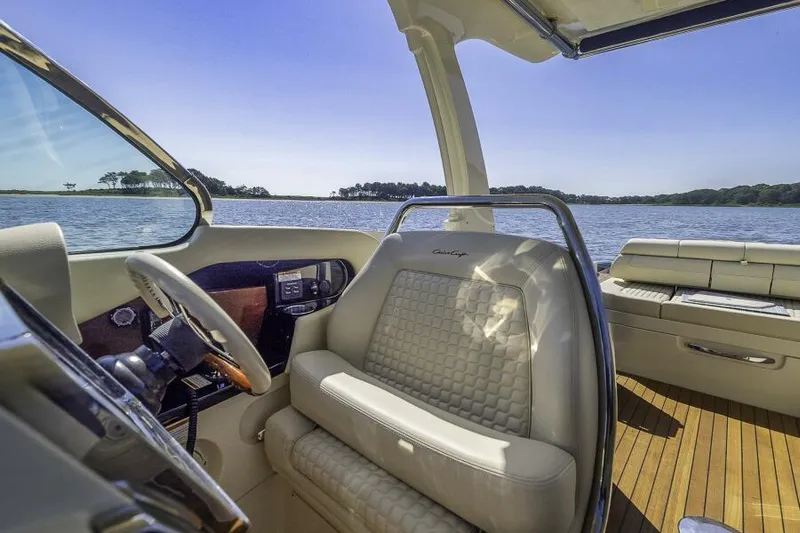 Get Back Yacht Photos Pics 2022 Chris-Craft Launch 31 GT interior with luxurious seating and scenic water view.