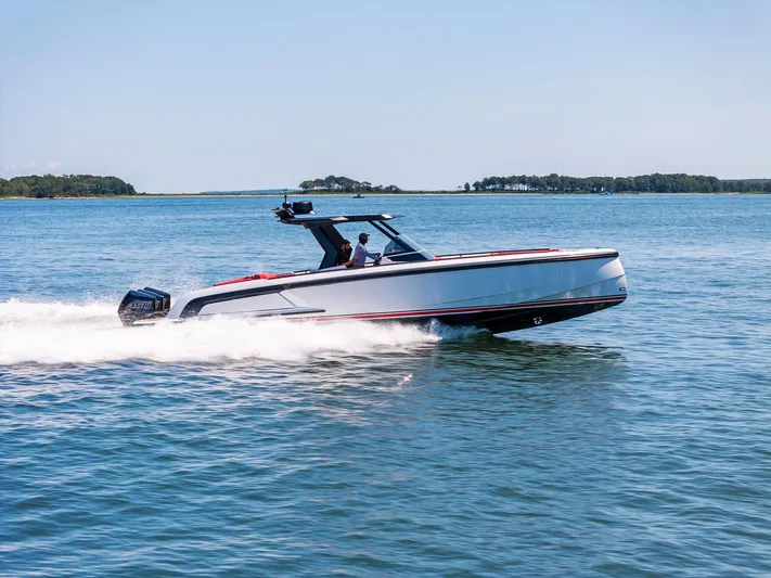 Outrageous Yacht Photos Pics 2024 Vanquish Yachts VQ 40 speeding on open water.