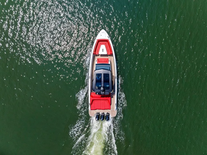 Outrageous Yacht Photos Pics Aerial view of 2024 Vanquish Yachts VQ 40 cruising on water.