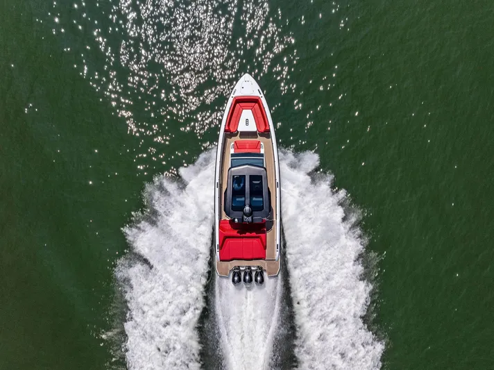 Outrageous Yacht Photos Pics Aerial view of 2024 Vanquish Yachts VQ 40 speeding on water.