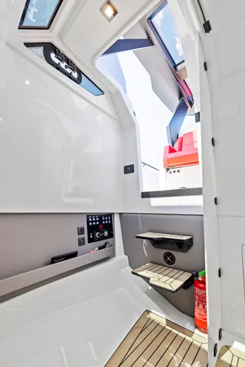 Outrageous Yacht Photos Pics 2024 Vanquish Yachts VQ 40 interior cabin with modern design and control panel.