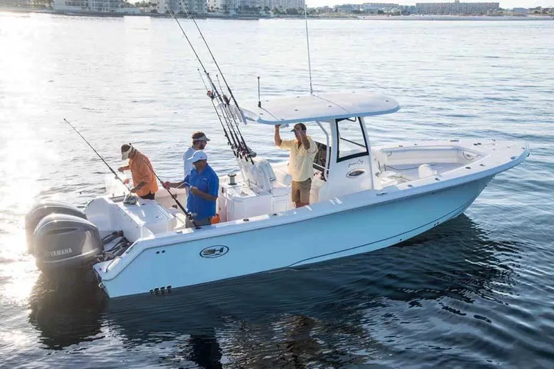  Yacht Photos Pics Manufacturer Provided Image: 2018 Sea Hunt Gamefish 30 boat with anglers fishing on calm water.