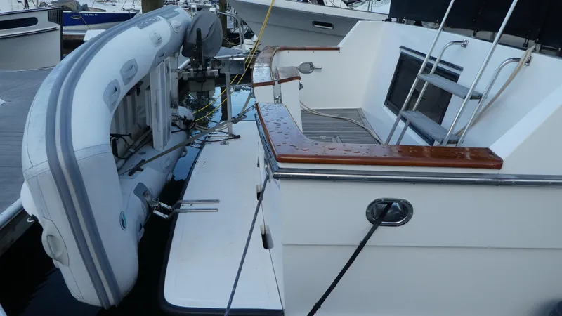Morning Star Yacht Photos Pics 1993 Ocean Alexander 440 Sundeck CPMY with dinghy on deck, docked at marina.
