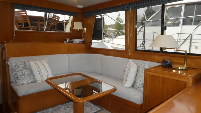 Morning Star Yacht Photos Pics Interior of 1993 Ocean Alexander 440 Sundeck CPMY with cozy seating and wooden accents.