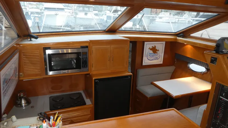 Morning Star Yacht Photos Pics Interior of 1993 Ocean Alexander 440 Sundeck CPMY with kitchen and dining area.