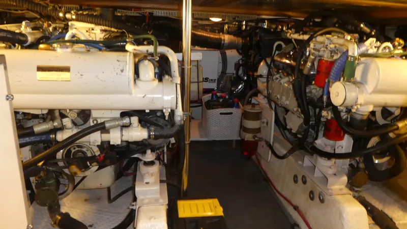 Morning Star Yacht Photos Pics Engine room of 1993 Ocean Alexander 440 Sundeck CPMY, showcasing dual engines and mechanical components.