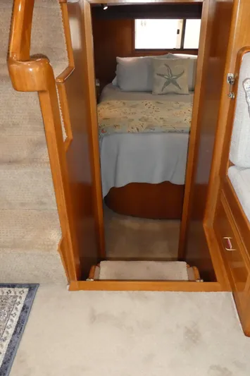 Morning Star Yacht Photos Pics 1993 Ocean Alexander 440 Sundeck CPMY interior cabin with bed and wooden furnishings.