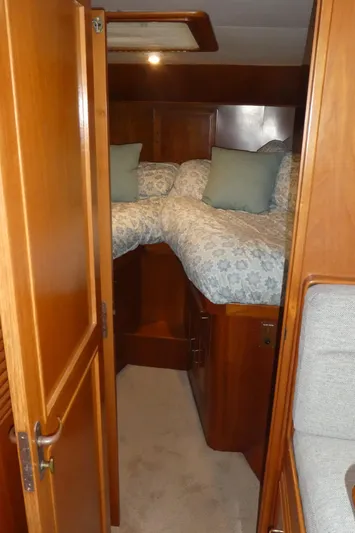 Morning Star Yacht Photos Pics 1993 Ocean Alexander 440 Sundeck CPMY cabin with cozy twin beds and wooden interior.