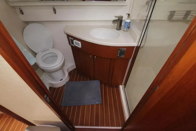  Yacht Photos Pics 2013 Cabo 40 Hardtop Express bathroom with toilet, sink, and shower.