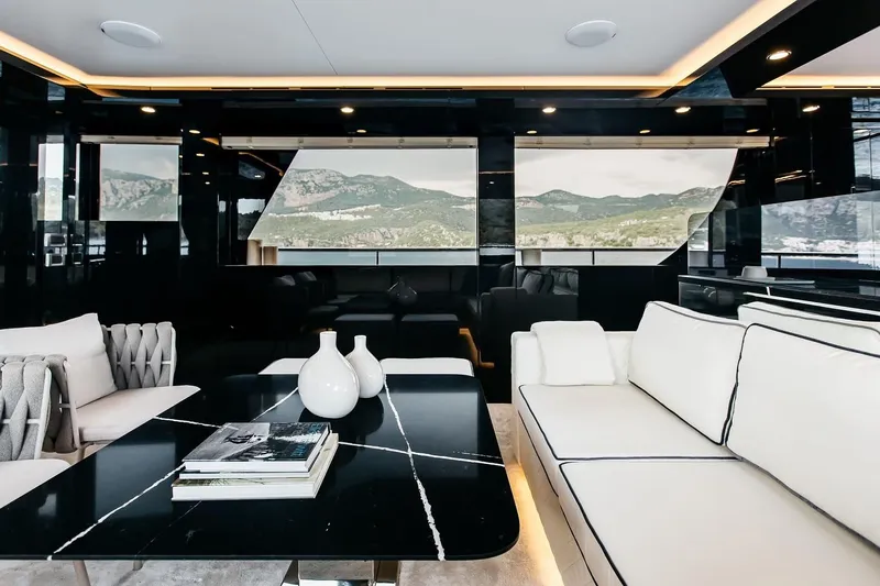  Yacht Photos Pics Luxurious interior of 2022 Bering 70 yacht with modern furnishings and scenic views.
