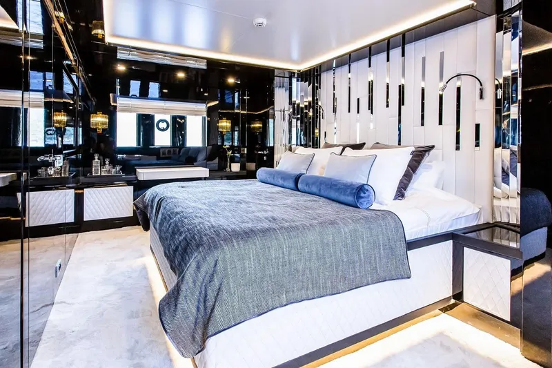  Yacht Photos Pics Luxurious bedroom interior on 2022 Bering 70 yacht, featuring modern design and elegant decor.