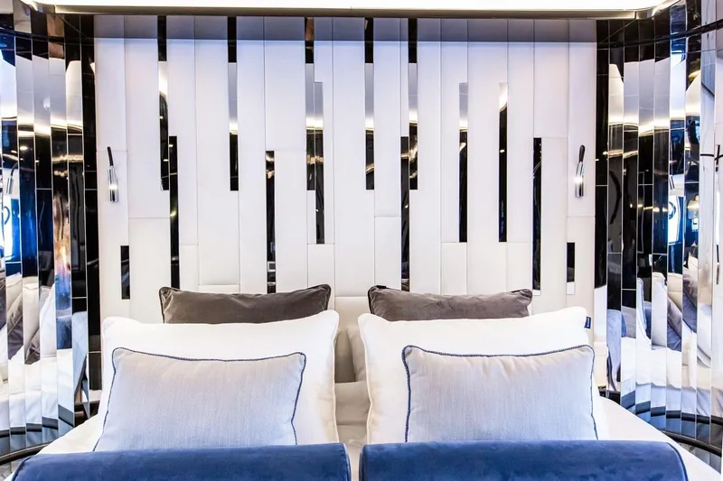  Yacht Photos Pics Luxurious interior of 2022 Bering 70 yacht with modern mirrored wall design.