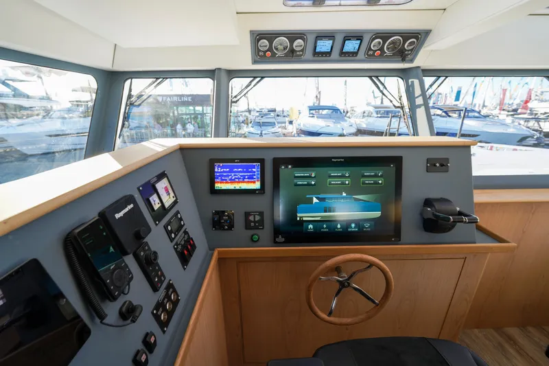  Yacht Photos Pics Modern helm station of 2025 Archipelago 47 yacht with advanced navigation systems.