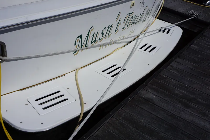 Musn't Touch It Yacht Photos Pics Egg Harbor 38 Sport Fish 1996 boat docked with name "Musn't Touch" visible.