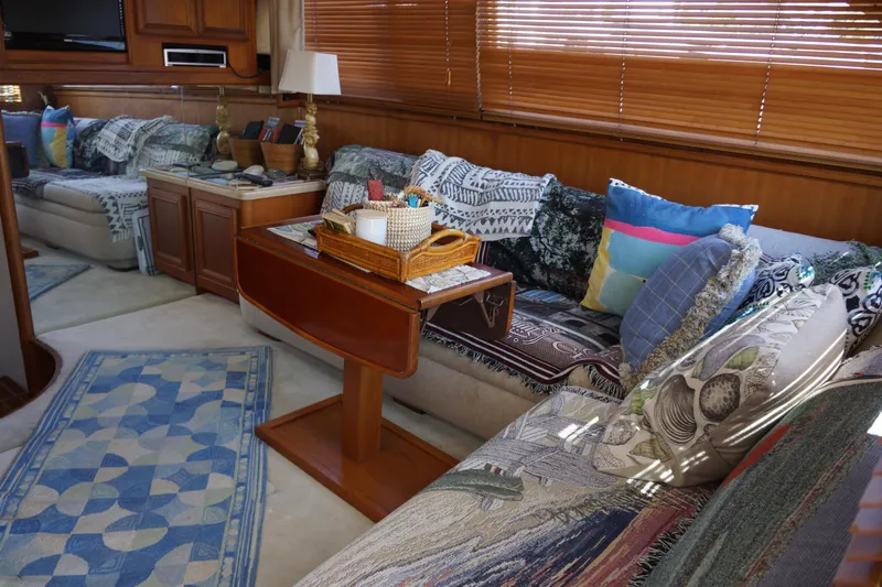 Musn't Touch It Yacht Photos Pics Luxurious interior of a 1996 Egg Harbor 38 Sport Fish yacht with cozy seating and decor.