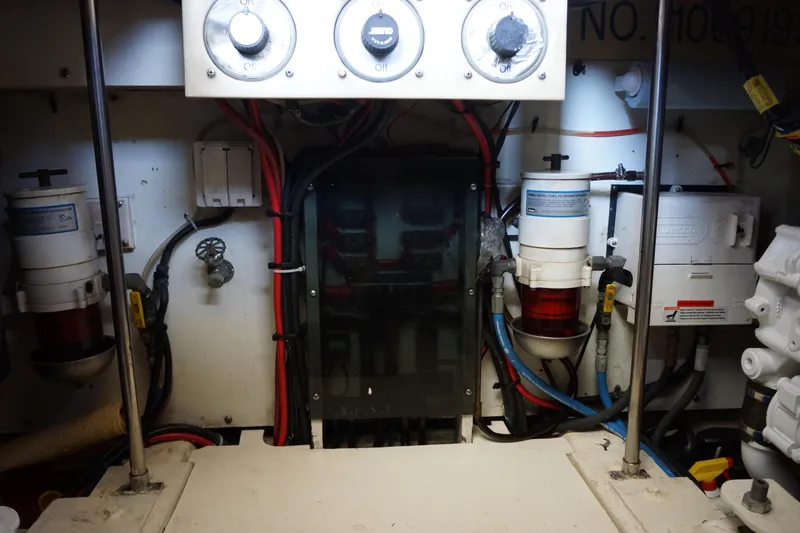 Musn't Touch It Yacht Photos Pics Engine room of 1996 Egg Harbor 38 Sport Fish boat, showing gauges and wiring.