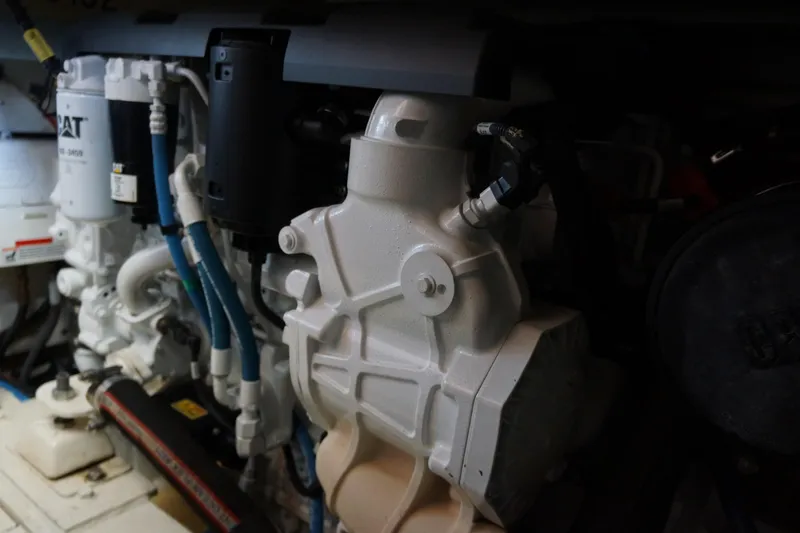 Musn't Touch It Yacht Photos Pics Engine compartment of a 1996 Egg Harbor 38 Sport Fish boat, showcasing mechanical components.