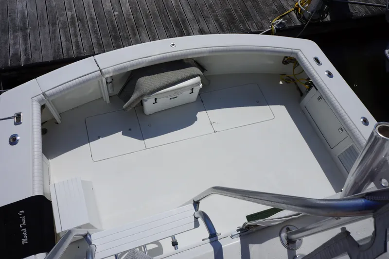 Musn't Touch It Yacht Photos Pics 1996 Egg Harbor 38 Sport Fish boat deck, spacious and well-maintained, docked at marina.