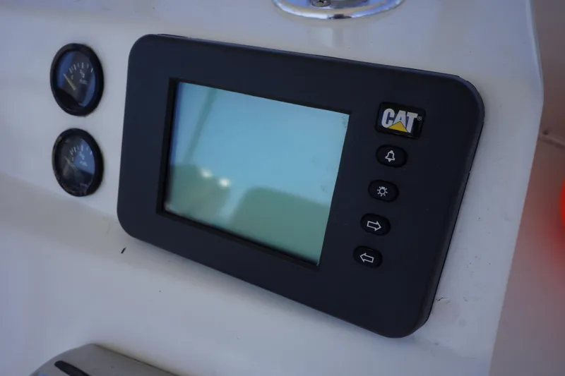 Musn't Touch It Yacht Photos Pics CAT display panel on 1996 Egg Harbor 38 Sport Fish boat dashboard.