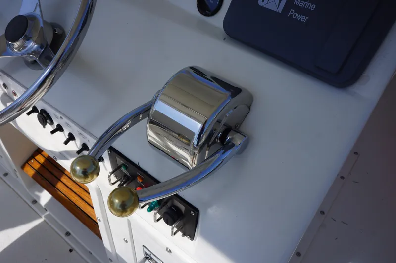 Musn't Touch It Yacht Photos Pics Close-up of 1996 Egg Harbor 38 Sport Fish boat controls and steering wheel.