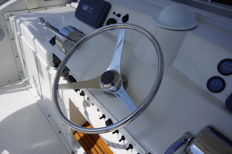 Musn't Touch It Yacht Photos Pics Steering wheel of a 1996 Egg Harbor 38 Sport Fish boat cockpit.
