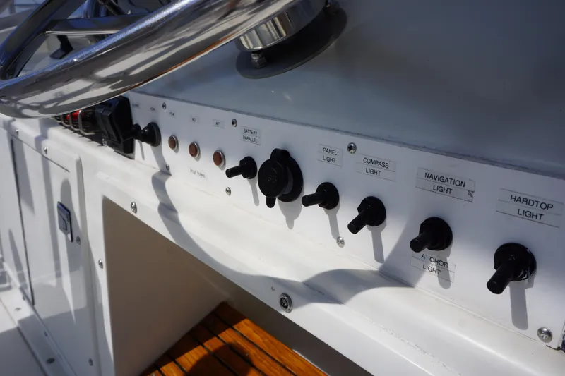 Musn't Touch It Yacht Photos Pics Control panel of a 1996 Egg Harbor 38 Sport Fish boat with various switches.