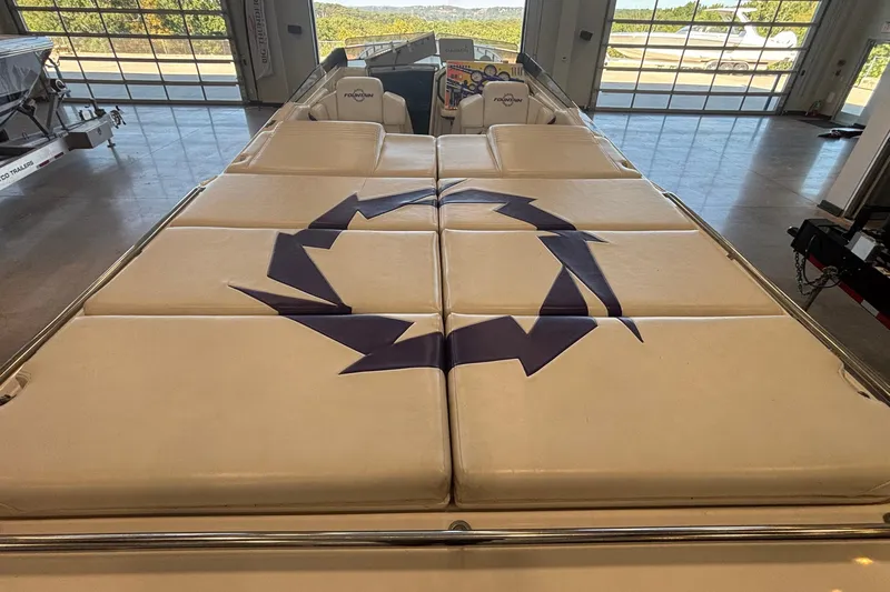  Yacht Photos Pics 2006 Fountain 42 Executioner boat interior with cushioned seating and logo design.