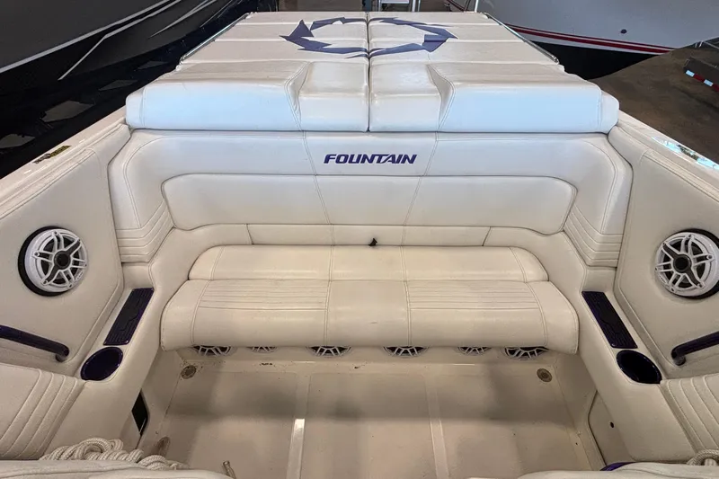  Yacht Photos Pics 2006 Fountain 42 Executioner boat interior with white seating and speaker system.