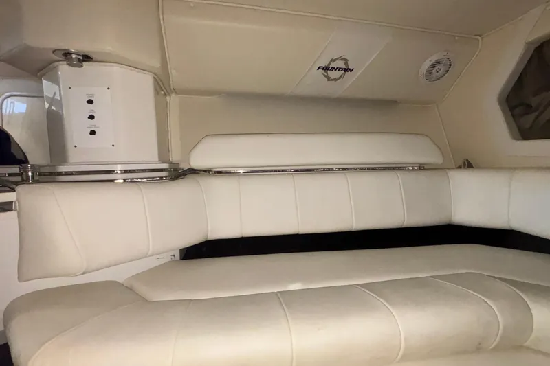  Yacht Photos Pics Interior of 2006 Fountain 42 Executioner boat with white leather seating.