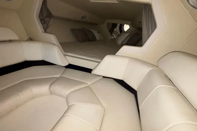  Yacht Photos Pics Interior of 2006 Fountain 42 Executioner boat with plush seating and sleeping area.