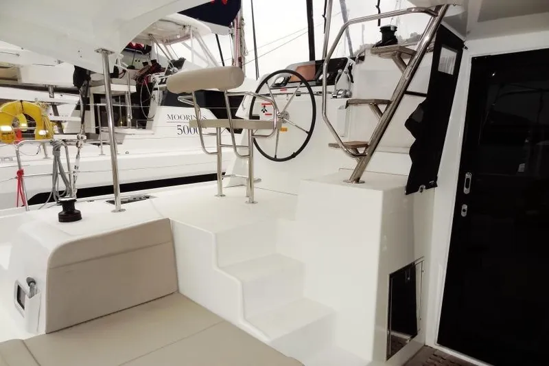 Pau Hana Yacht Photos Pics Lagoon 42 catamaran cockpit with steering wheel and seating, 2020 model.