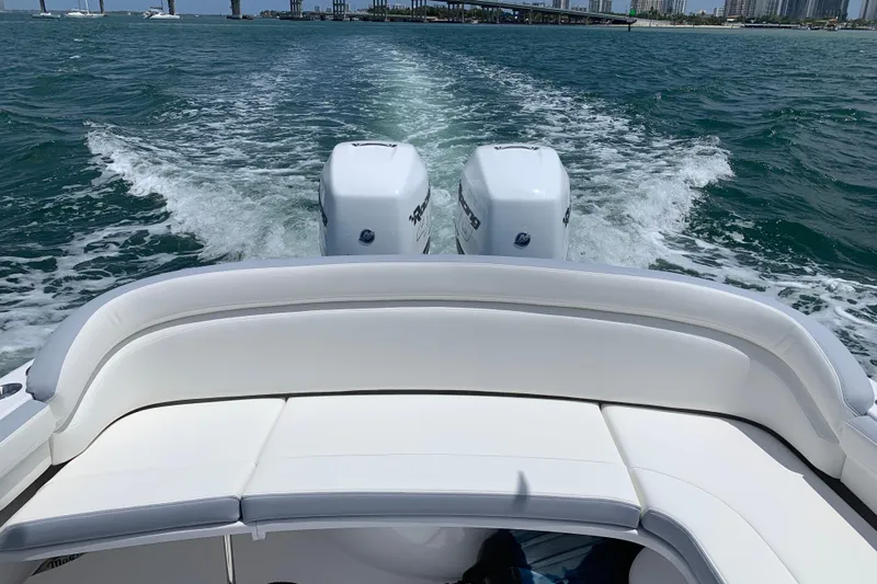  Yacht Photos Pics 2019 Mag Bay 33 CC boat cruising with twin engines on open water.