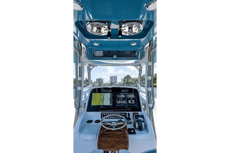  Yacht Photos Pics 2019 Mag Bay 33 CC boat helm with navigation screens and controls.