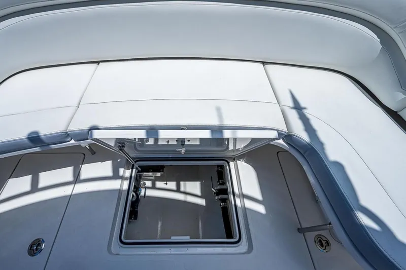  Yacht Photos Pics 2019 Mag Bay 33 CC boat with open storage compartment on deck.