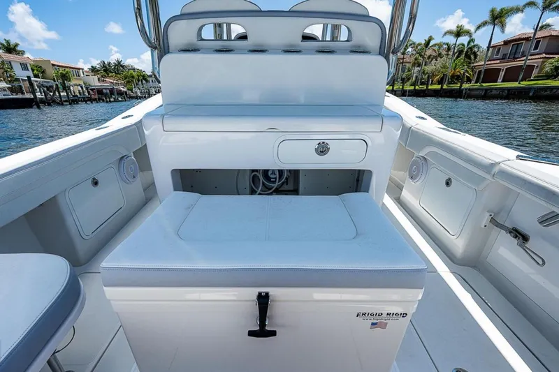  Yacht Photos Pics 2019 Mag Bay 33 CC boat interior with seating and storage, dockside view.