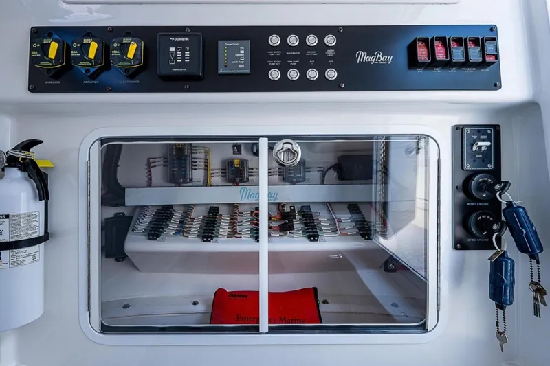 Yacht Photos Pics Control panel of 2019 Mag Bay 33 CC boat with safety equipment and keys.
