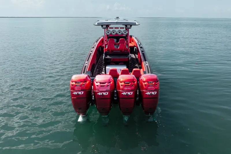  Yacht Photos Pics 2002 Midnight Express 39S Cuddy boat with four red 400 horsepower engines on water.