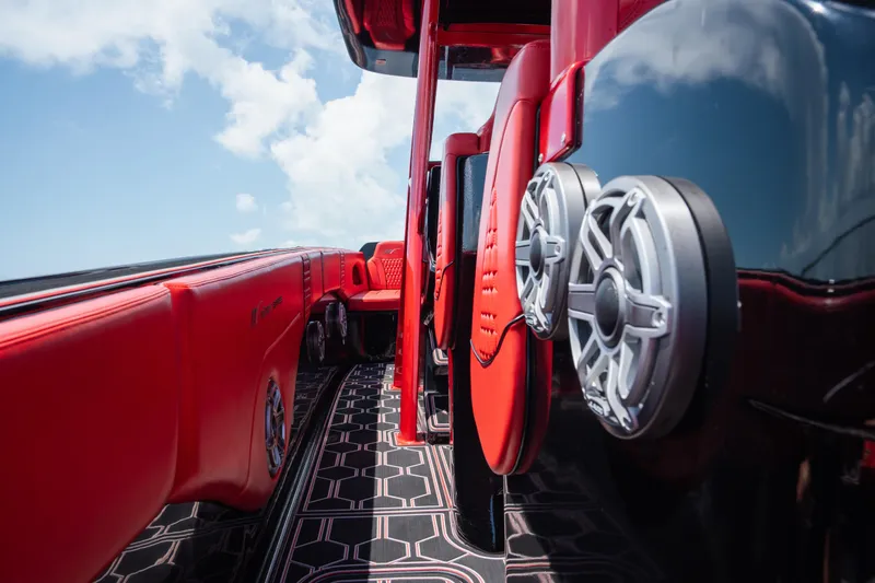  Yacht Photos Pics Red and black interior of 2002 Midnight Express 39S Cuddy boat with speakers.