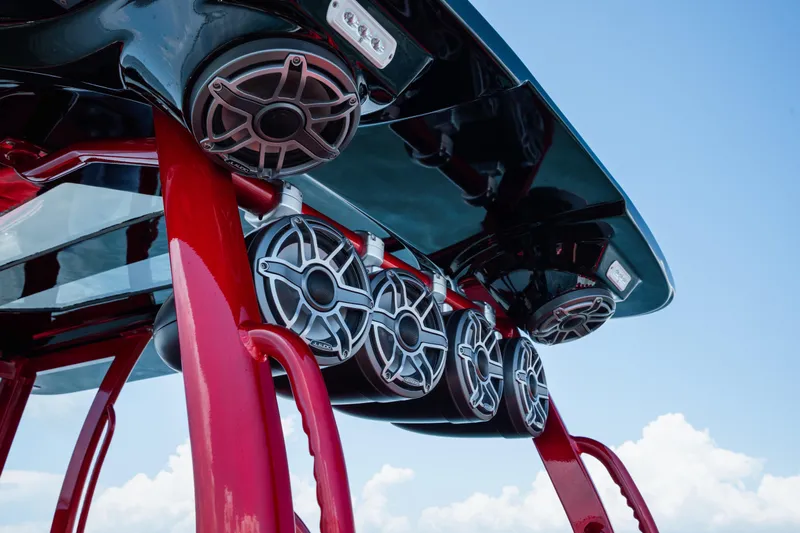  Yacht Photos Pics Red and black speakers on a 2002 Midnight Express 39S Cuddy boat against blue sky.