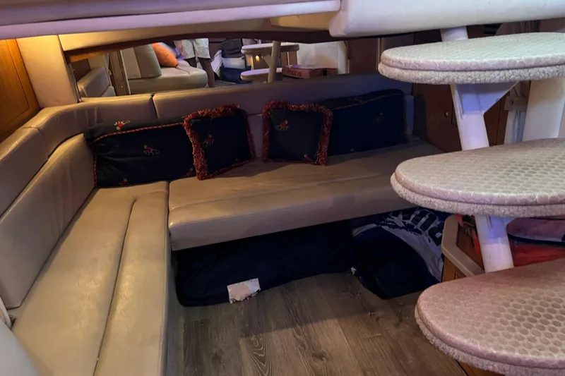 Wasn't Me Yacht Photos Pics Interior of 2006 Sea Ray 340 Sundancer with cozy seating and decorative pillows.